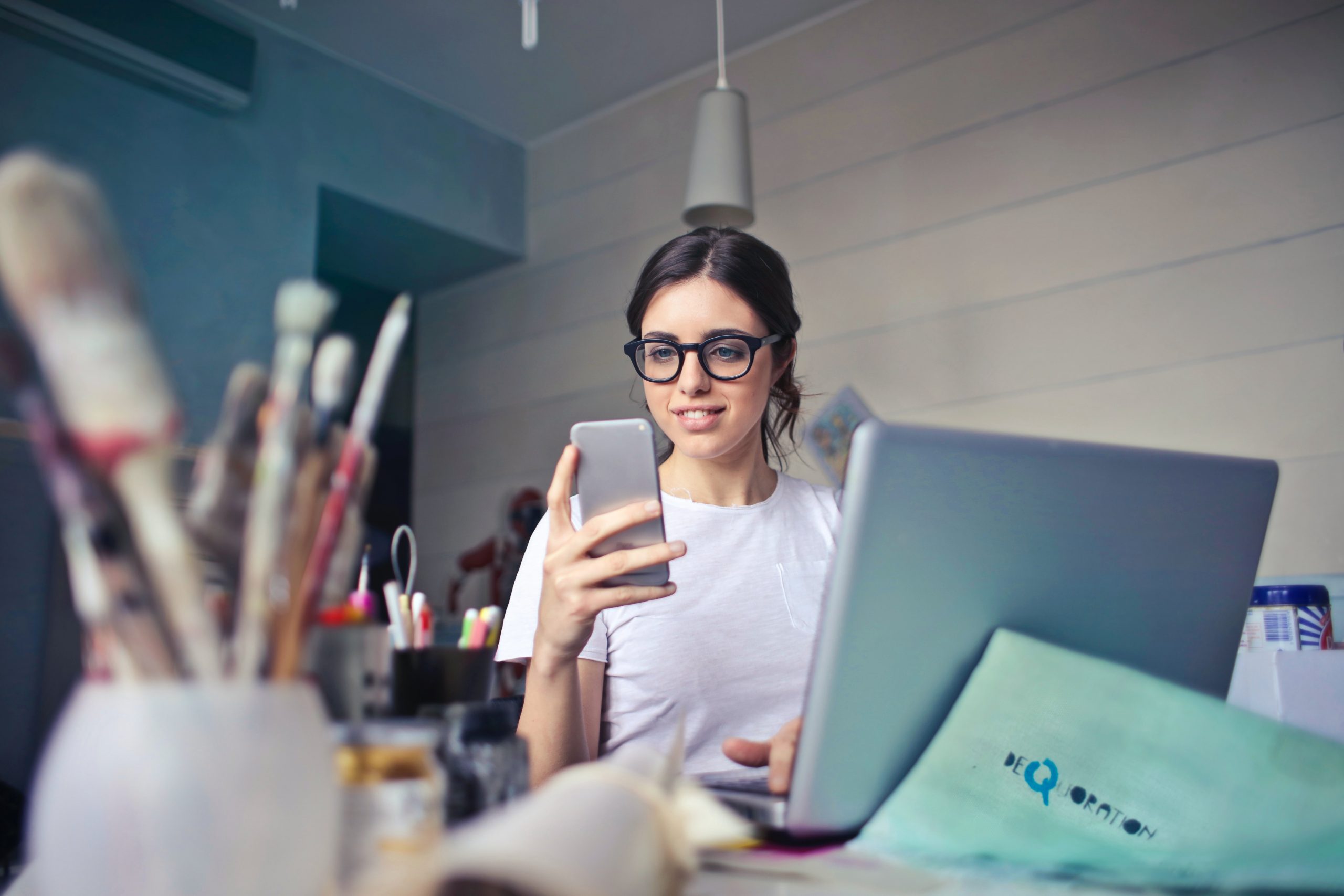 Gen Z using phone and laptop Hero image